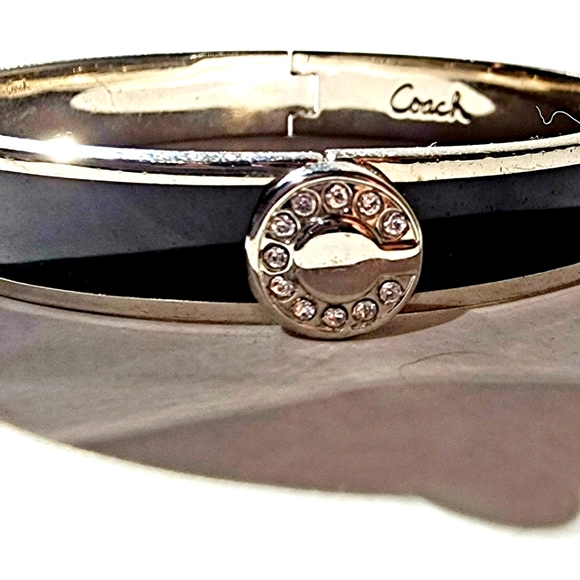Coach Jewelry - Rare find Coach black and silver hinge bangle